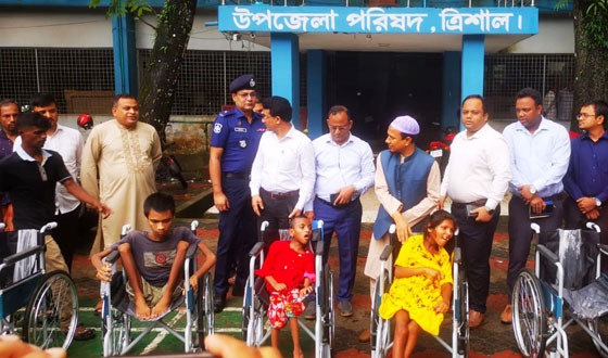 ত্রিশালে হুইল চেয়ার বিতরণ ও সামাজিক নিরাপত্তা বিষয়ক সেমিনার